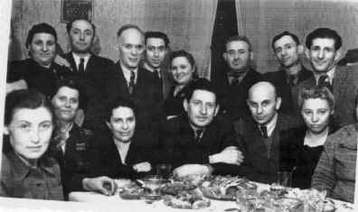 Photograph of Belchatow survivors at a meal.